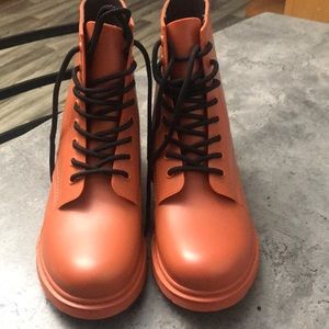 Orange rubber combat boots